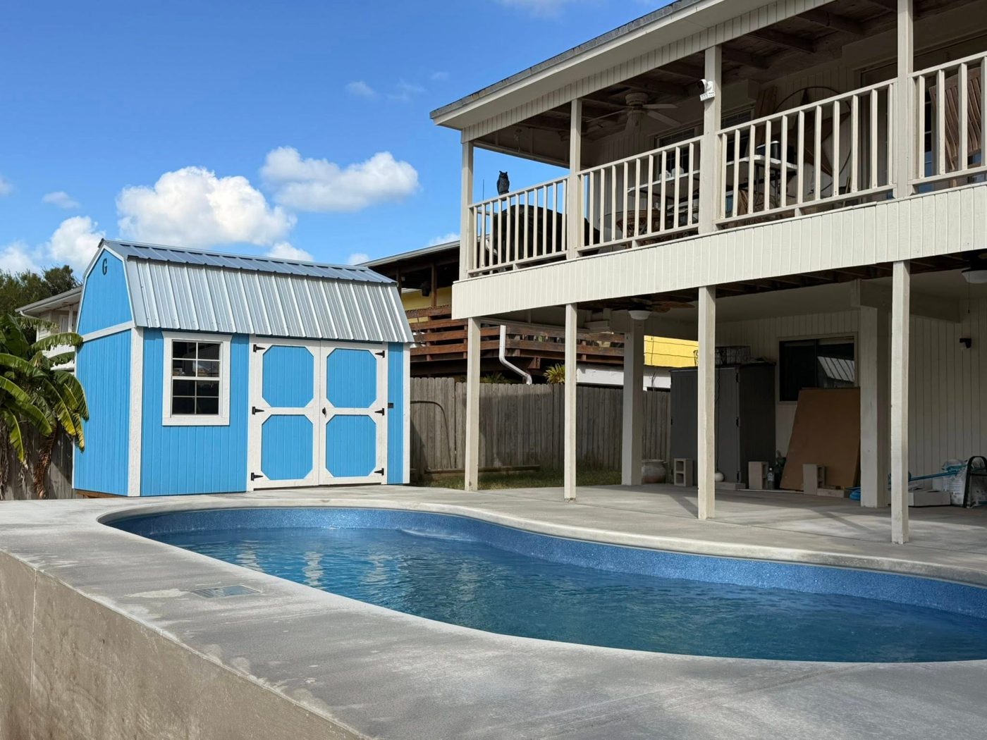 A real Kinetic freeform fiberglass pool that transformed a Coastal Bend backyard, with a finished concrete deck